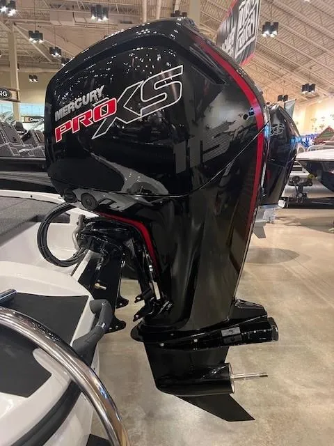 Slide: The Image of Mercury Pro XS outboard motor on Nitro Z17, 2025 model, displayed indoors. - 2