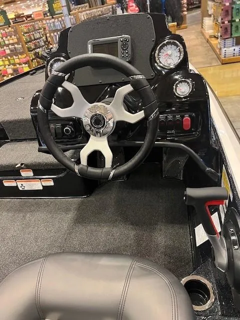 Slide: The Image of 2025 Nitro Z17 boat cockpit with steering wheel and control panel. - 4