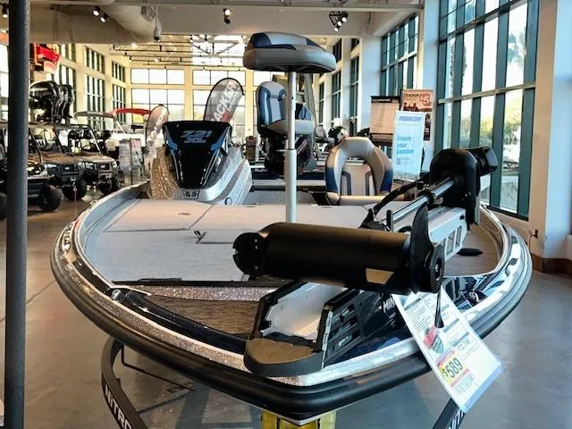 Slide: The Image of 2025 Nitro Z21 XL boat displayed in a showroom with modern interior design. - 2