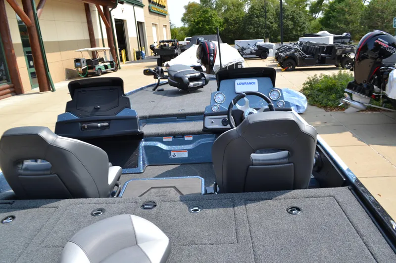 Slide: The Image of 2025 Nitro Z20 XL boat interior with steering wheel and seating. - 2