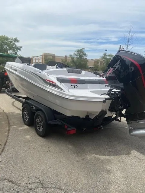 Slide: The Image of 2025 Tahoe T21 boat on trailer, parked outdoors. - 4