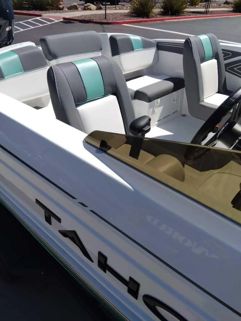 Slide: The Image of 2025 Tahoe T21 boat with modern seating and sleek design. - 5