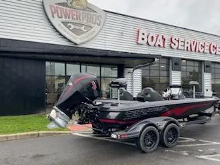 Slide: The Image of 2025 Nitro Z21 XL Pro boat at service center, parked on trailer. - 12