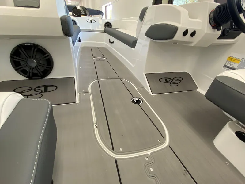 Slide: The Image of 2025 Tahoe T21 boat interior with sleek gray flooring and modern seating. - 6