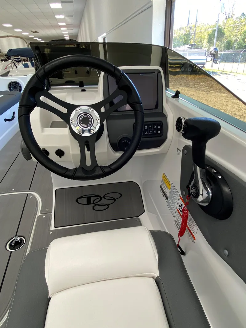 Slide: The Image of 2025 Tahoe T21 boat cockpit with steering wheel and control panel. - 9