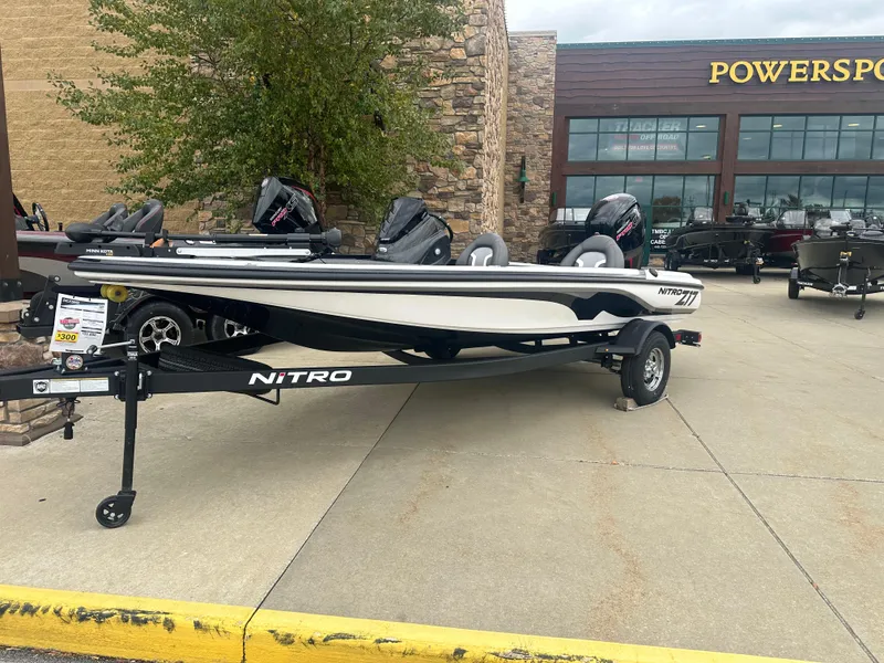 Slide: The Image of 2025 Nitro Z17 boat displayed outside Powersports store. - 0