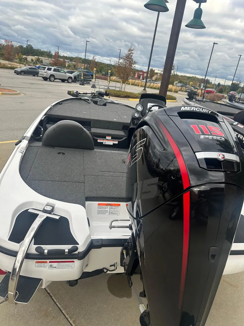 Slide: The Image of 2025 Nitro Z17 boat with Mercury engine in parking lot. - 2