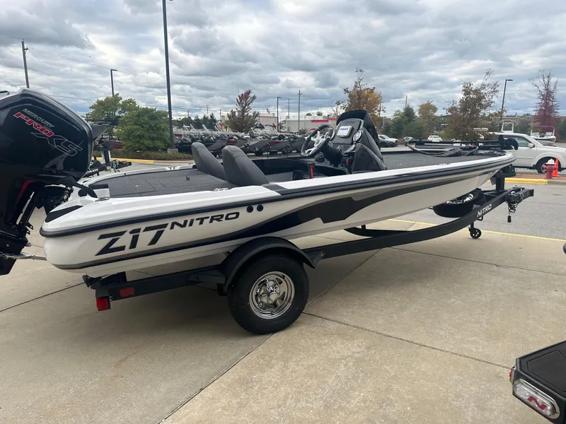 Slide: The Image of 2025 Nitro Z17 boat on trailer, parked outdoors under cloudy sky. - 3