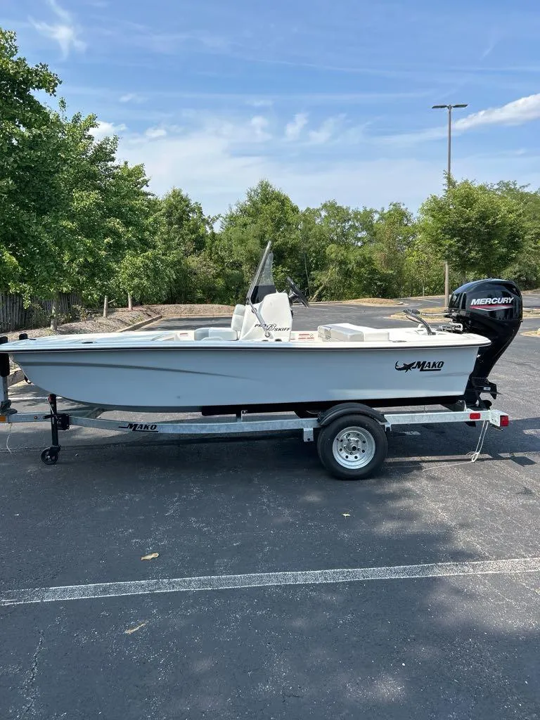 The Image of 2025 Mako Pro Skiff 13 CC boat on trailer in parking lot. - 0