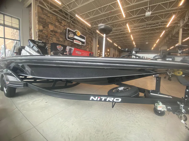 Slide: The Image of 2025 Nitro Z20 XL Pro boat displayed in a showroom with modern lighting. - 2