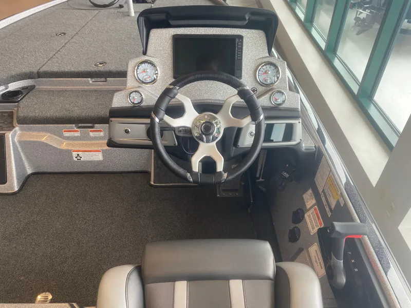 Slide: The Image of 2025 Nitro Z20 XL Pro boat cockpit with steering wheel and dashboard controls. - 5