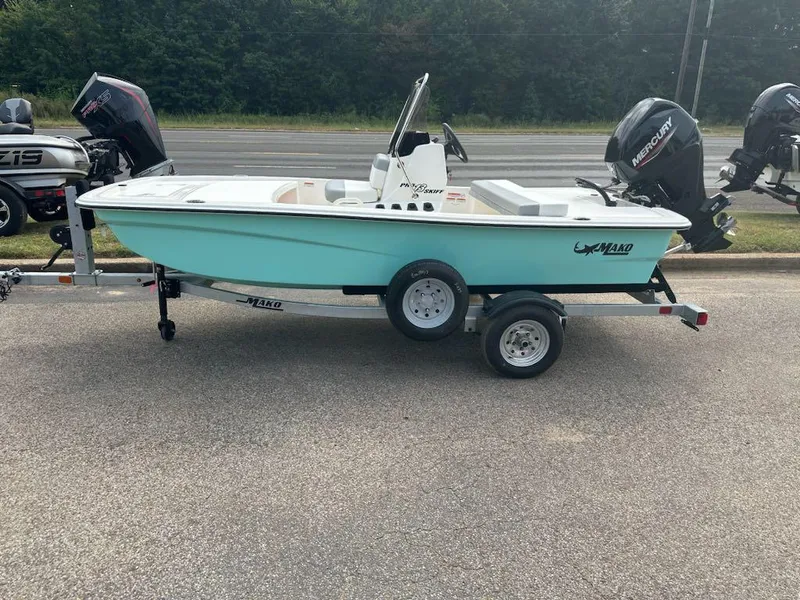 The Image of 2025 Mako Pro Skiff 13 CC boat on trailer, parked outdoors. - 0
