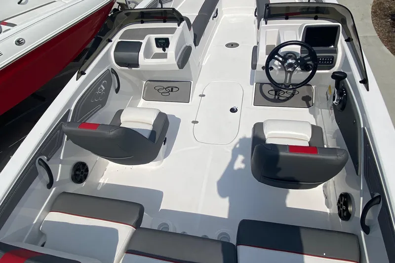Slide: The Image of 2025 Tahoe T21 boat interior with modern seating and steering console. - 1