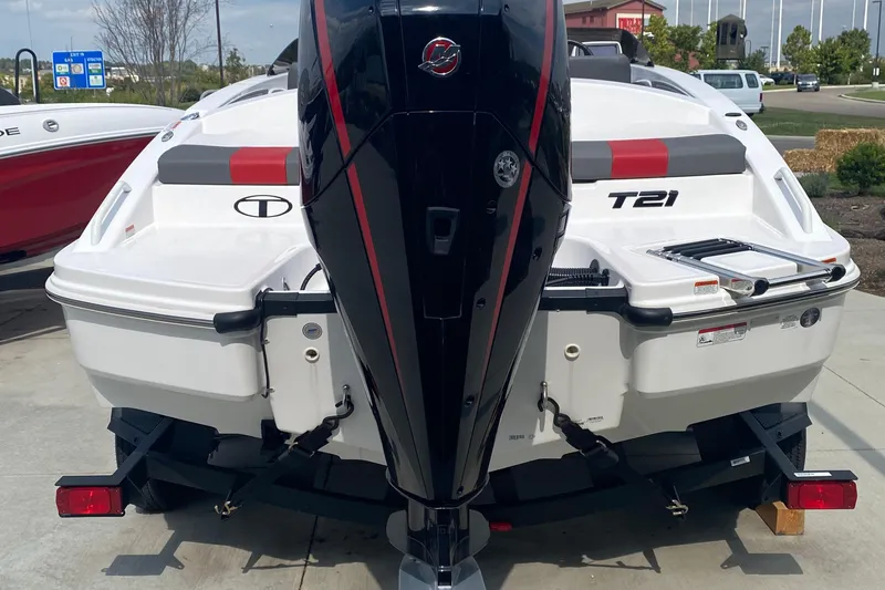 Slide: The Image of 2025 Tahoe T21 boat with powerful outboard motor, parked on a trailer. - 4