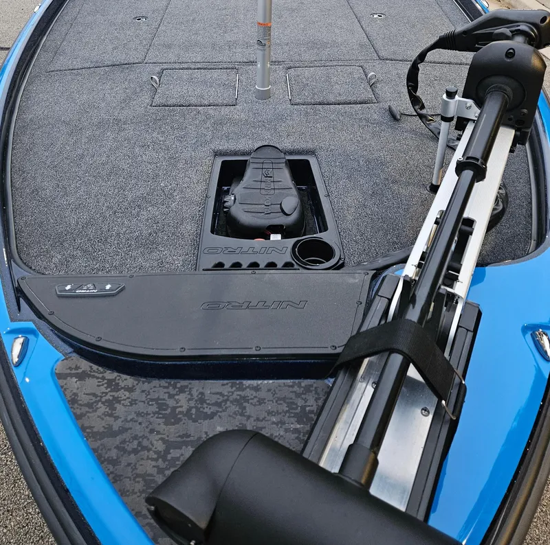 Slide: The Image of 2025 Nitro Z21 XL boat deck with trolling motor and storage compartments. - 2