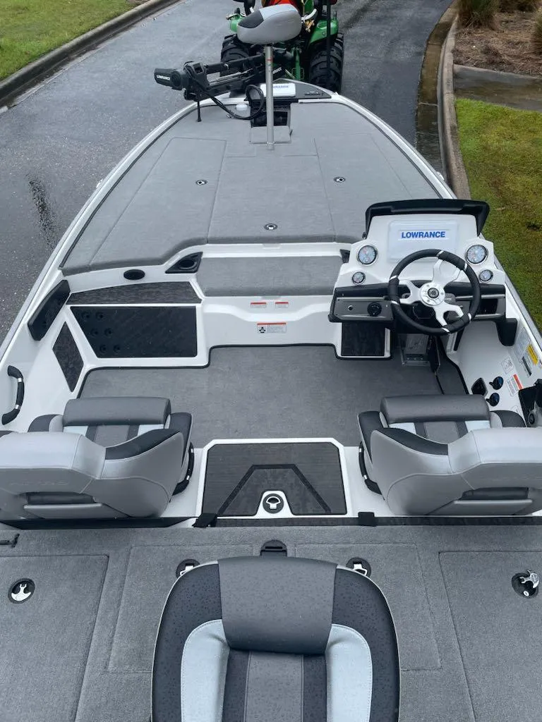 Slide: The Image of 2025 Nitro Z20 XL boat interior with steering console and seating. - 4