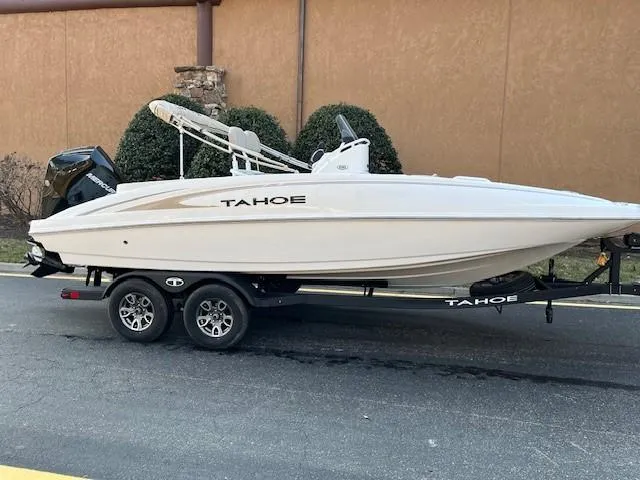 The Image of 2025 Tahoe 2150 CC boat on trailer, parked outdoors, side view. - 0