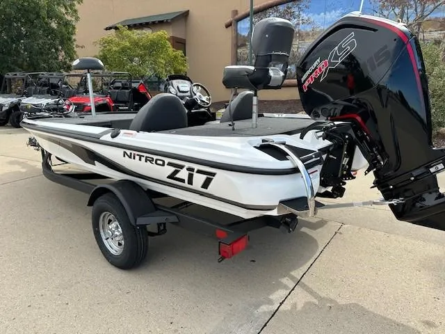 Slide: The Image of 2025 Nitro Z17 boat with powerful outboard motor on trailer. - 2