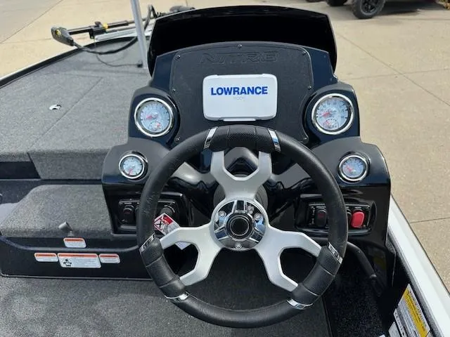 Slide: The Image of 2025 Nitro Z17 boat dashboard with steering wheel and Lowrance display. - 5