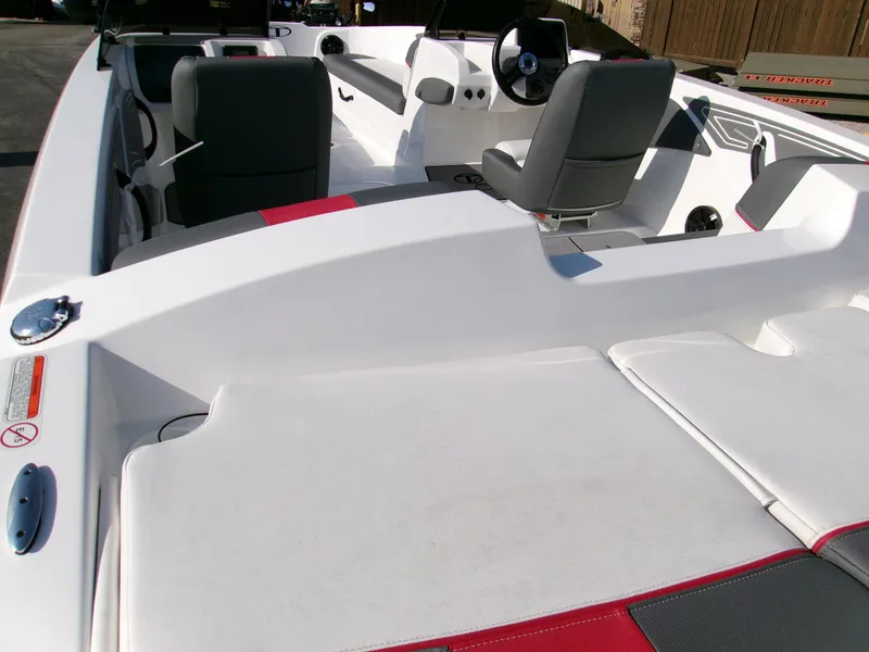 Slide: The Image of 2025 Tahoe T21 boat interior with gray seats and white deck. - 3