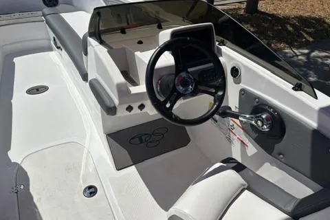 Slide: The Image of 2025 Tahoe T21 boat interior with steering wheel and dashboard controls. - 8