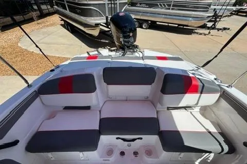 Slide: The Image of 2025 Tahoe T21 boat interior with cushioned seating and modern design. - 10