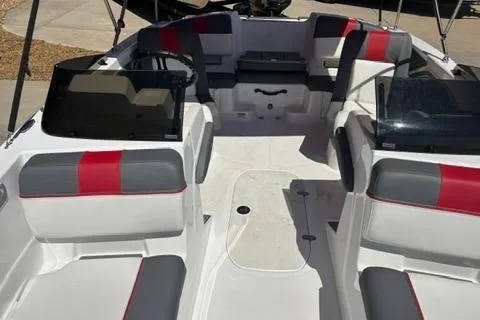 Slide: The Image of Interior view of 2025 Tahoe T21 boat with red and gray seating. - 7