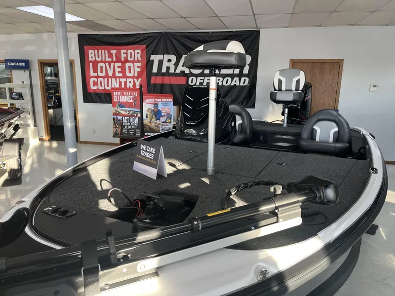 Slide: The Image of 2025 Nitro Z17 boat displayed in showroom with promotional banners. - 4