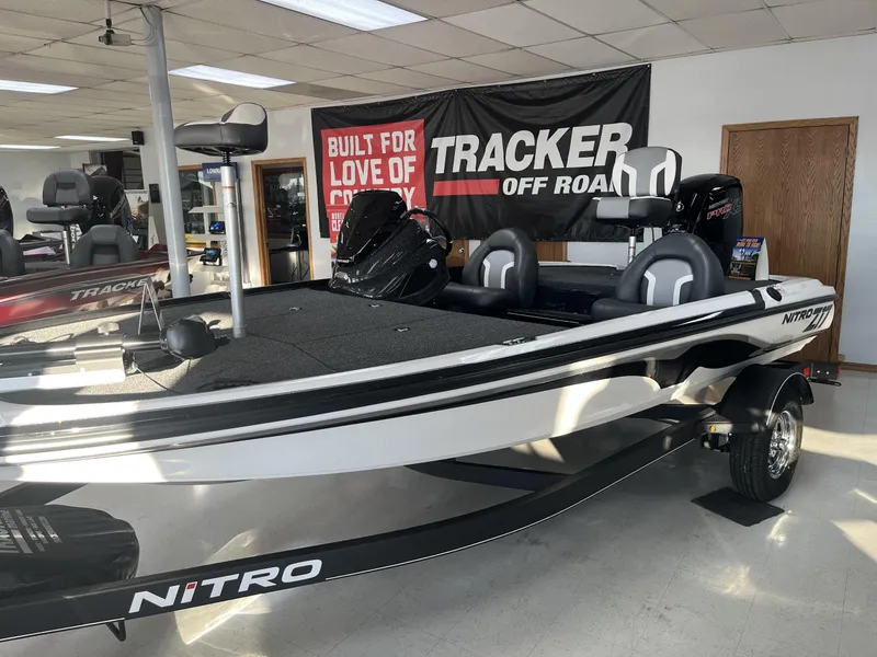 Slide: The Image of 2025 Nitro Z17 boat in showroom with Tracker Off Road banner. - 6