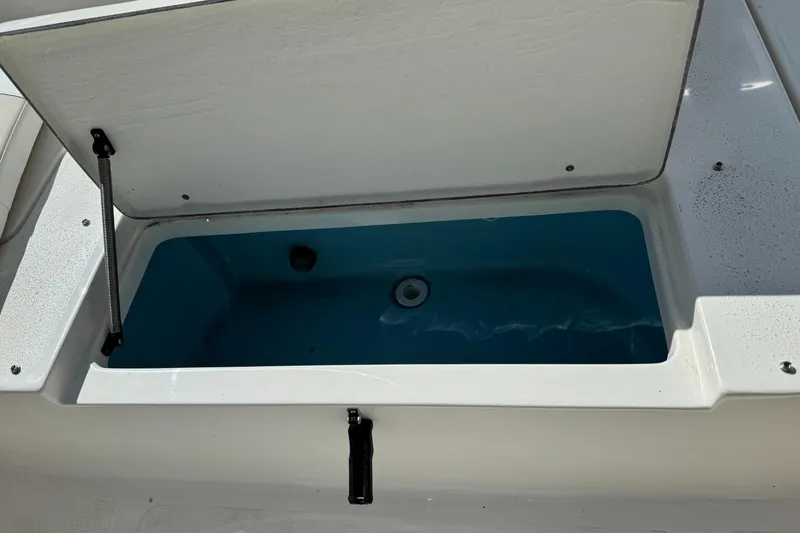 Slide: The Image of Open storage compartment on 2025 Bulls Bay 2200 boat. - 21
