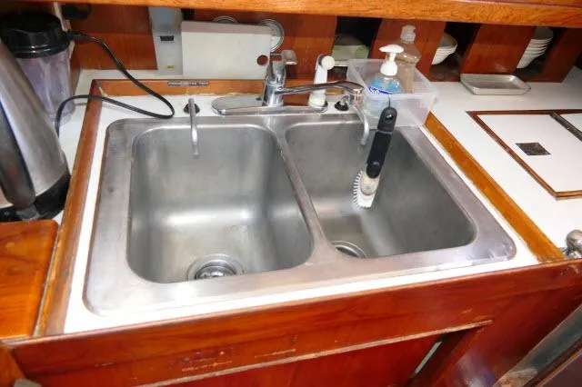 Slide: The Image of Stainless steel double sink in a 1976 Peterson 44 kitchen. - 12