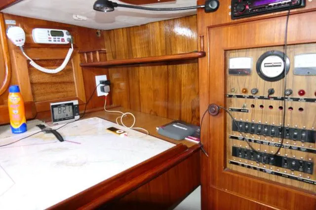 Slide: The Image of Navigation station of 1976 Peterson 44 yacht with control panel and equipment. - 17