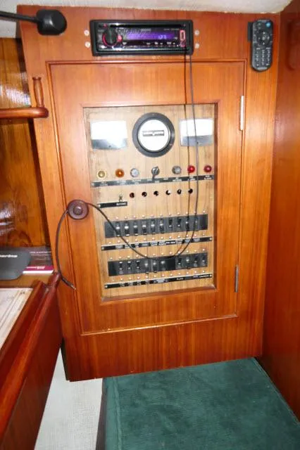 Slide: The Image of 1976 Peterson 44 yacht electrical panel with gauges and controls. - 18