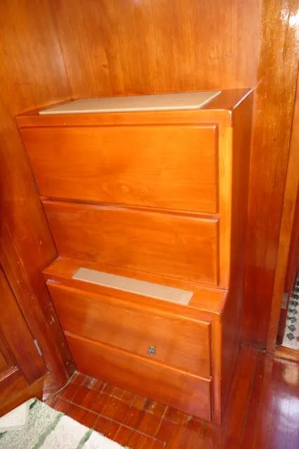 Slide: The Image of Vintage Peterson 44 wooden cabinet from 1976 with three drawers, rich wood finish. - 29