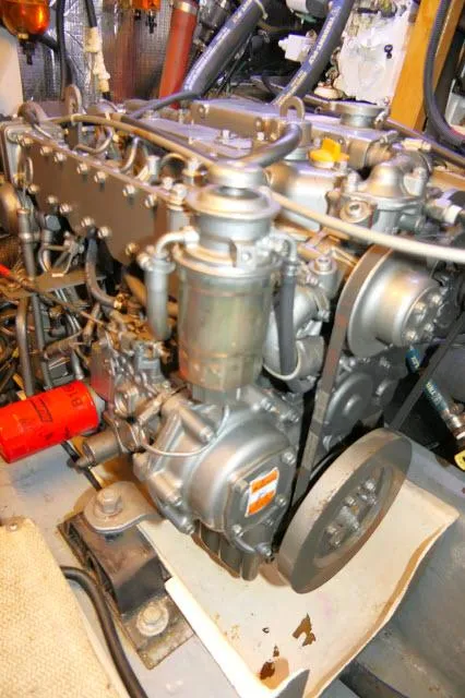 Slide: The Image of 1976 Peterson 44 engine, detailed view of mechanical components and wiring. - 42