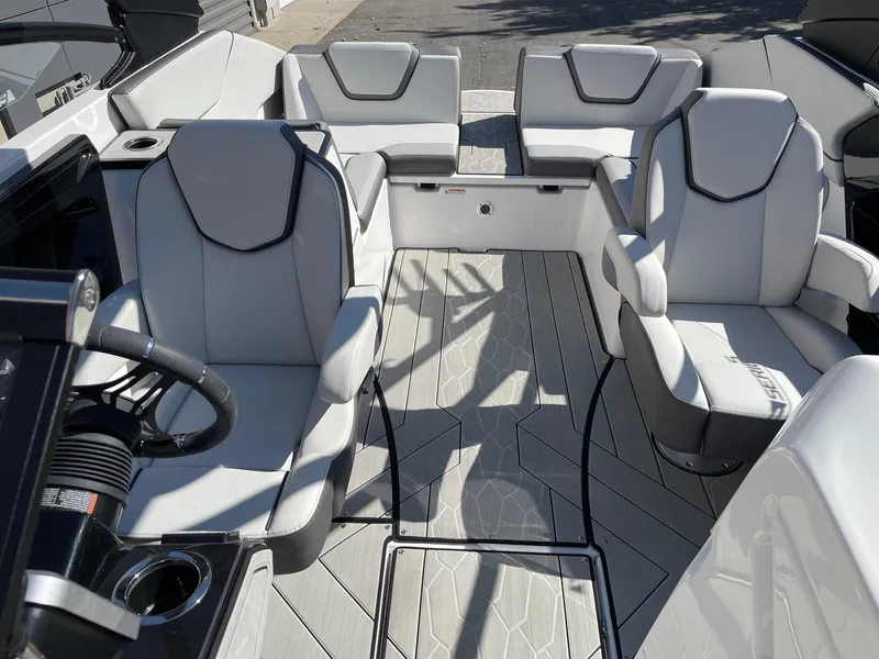 Slide: The Image of 2024 Yamaha Boats 252XE interior with modern seating and sleek design. - 11