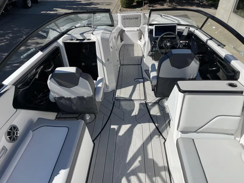 Slide: The Image of 2024 Yamaha Boats 252XE interior, featuring sleek seating and modern dashboard design. - 4