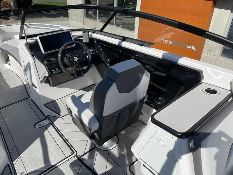 Slide: The Image of 2024 Yamaha Boats 252XE cockpit with modern dashboard and seating. - 5