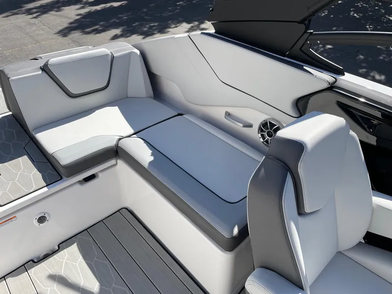 Slide: The Image of 2024 Yamaha Boats 252XE interior with sleek white seating and modern design. - 8