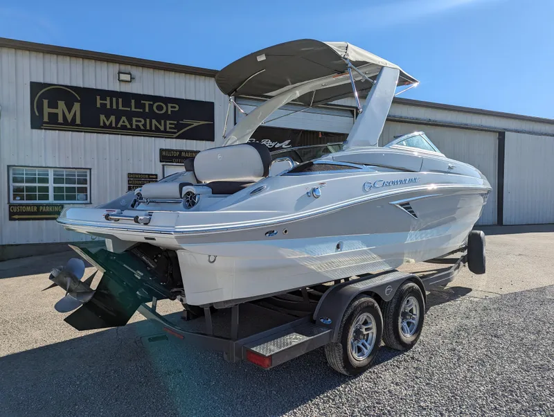 Slide: The Image of 2023 Crownline 260 SS boat on trailer at Hilltop Marine dealership. - 10