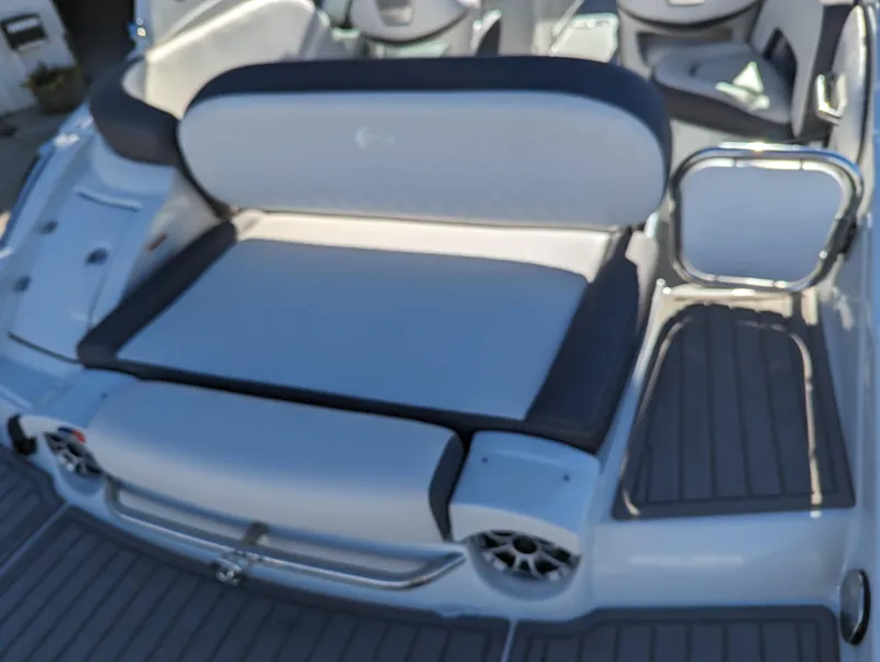 Slide: The Image of 2023 Crownline 260 SS boat interior with cushioned seating and sleek design. - 17