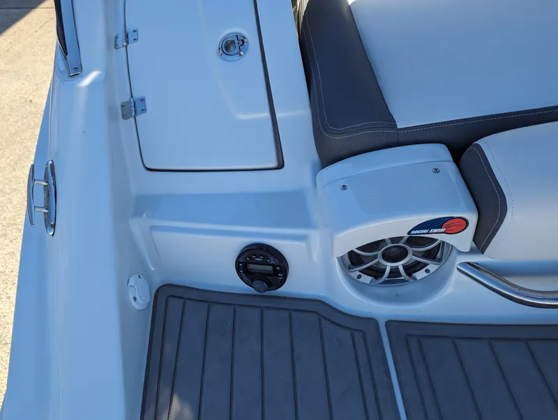 Slide: The Image of 2023 Crownline 260 SS boat interior with speaker and seating detail. - 19