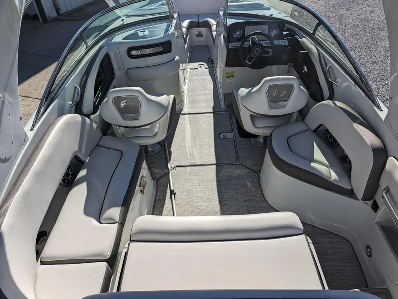 Slide: The Image of 2023 Crownline 260 SS boat interior with spacious seating and modern dashboard. - 20