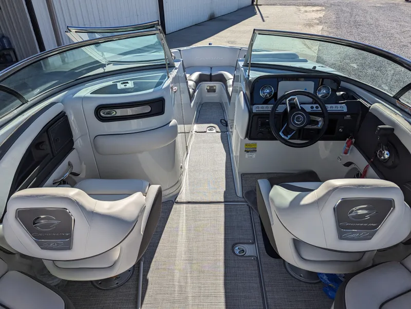 Slide: The Image of 2023 Crownline 260 SS boat interior with modern dashboard and seating. - 21