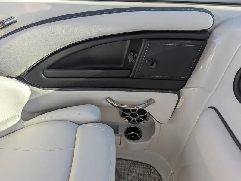 Slide: The Image of Interior detail of 2023 Crownline 260 SS boat, featuring sleek seating and modern design elements. - 26