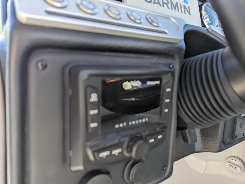 Slide: The Image of Control panel of 2023 Crownline 260 SS boat with Garmin equipment. - 28