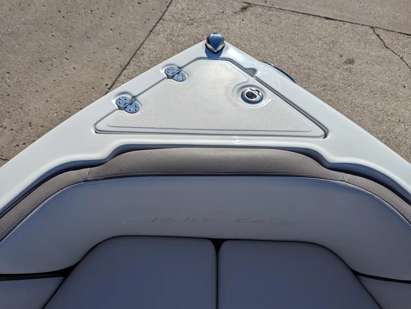 Slide: The Image of 2023 Crownline 260 SS boat bow with sleek design and cushioned seating. - 29