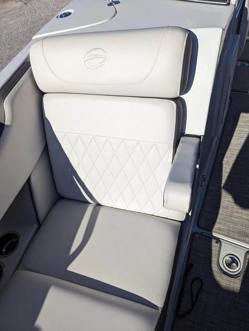 Slide: The Image of 2023 Crownline 260 SS boat seat with diamond-pattern upholstery and armrest. - 31