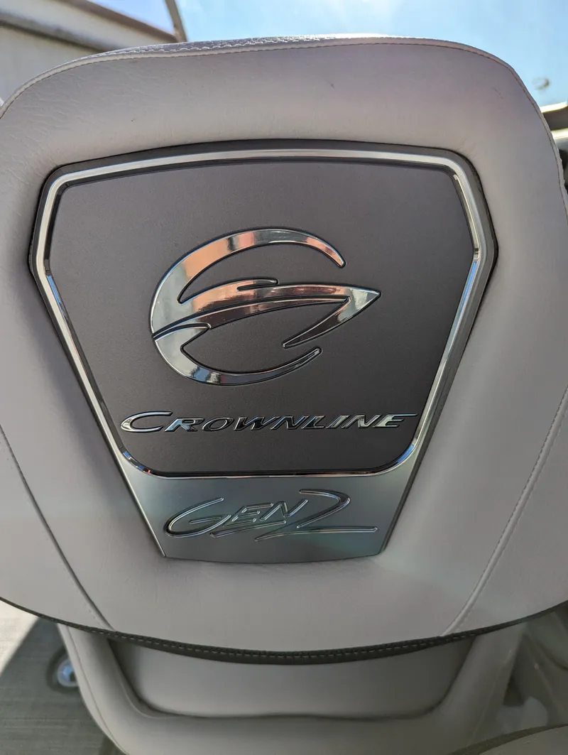 Slide: The Image of 2023 Crownline 260 SS boat seat with logo and emblem detail. - 39
