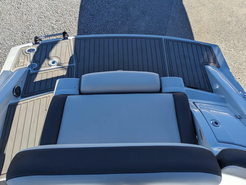 Slide: The Image of 2023 Crownline 260 SS boat deck with cushioned seating and sleek design. - 41